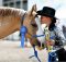girl kissing prizewinning horse